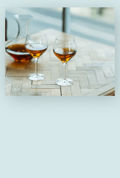 Hojicha 100g on a table with person reading a book